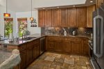 There`s plenty granite counter space for prepping meals